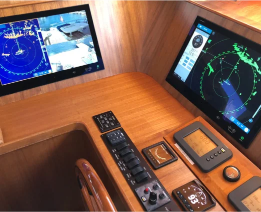 Helm console with multifunction displays and switch panel in wood trim
