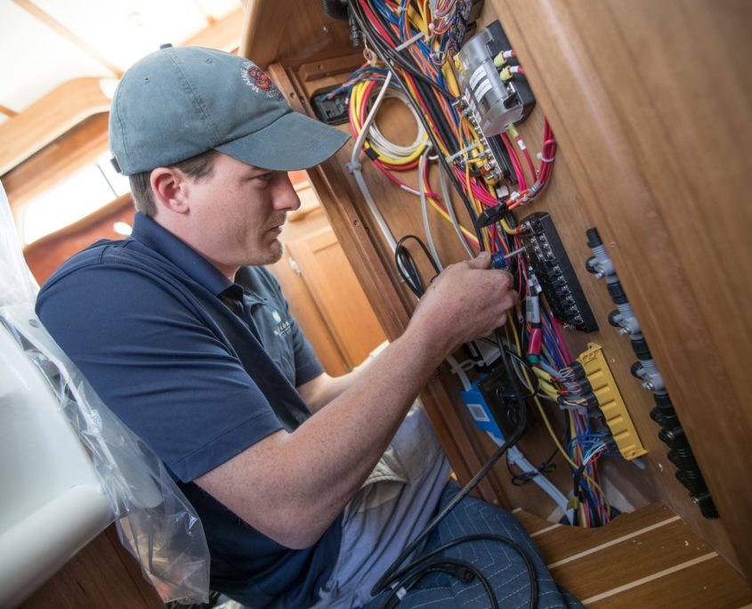 Navtronics employee working on electronics